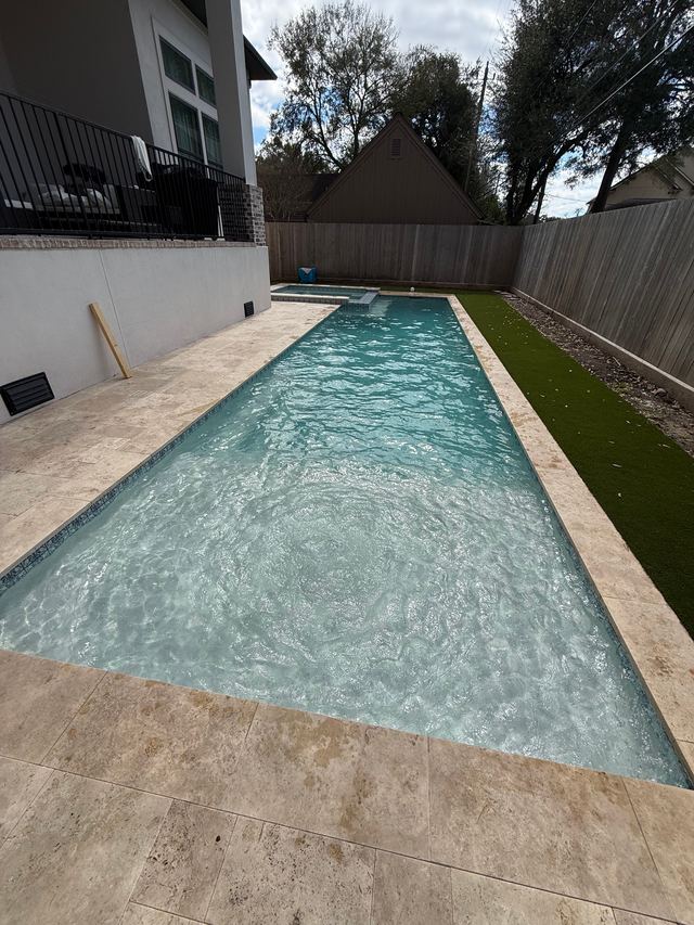 Example photo: a long rectangular pool shot from one end, the whole pool in the frame